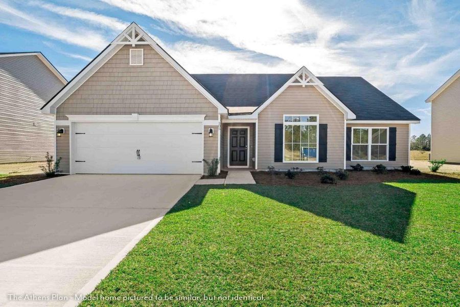 Front exterior of a home in the Covington Pointe community, located in Brunswick, GA (Image 9).