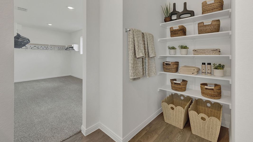 Furnished interior in a model home at Paramount in Kyle (Image 24).