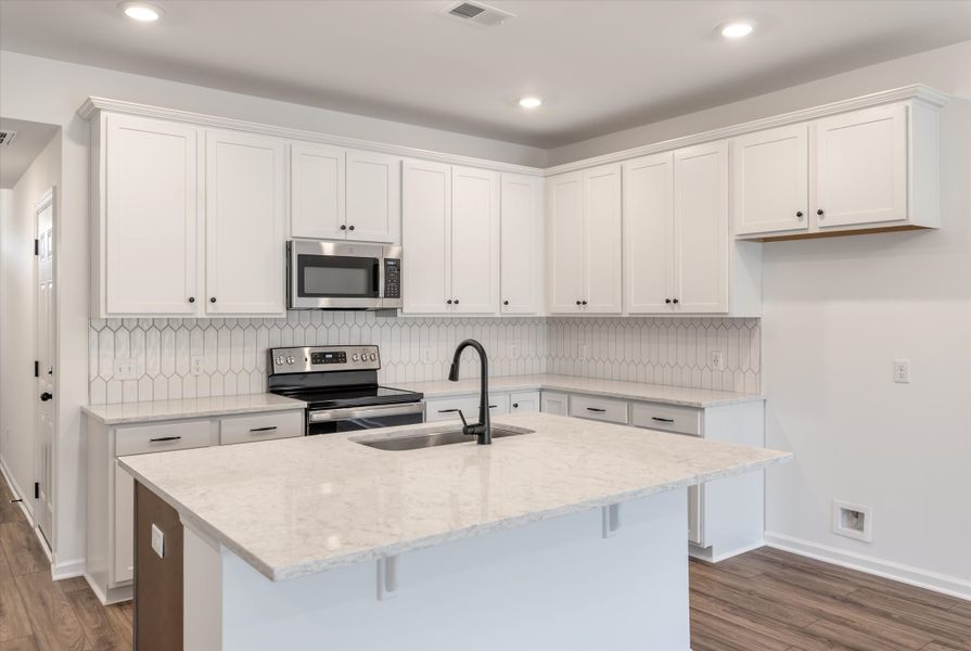 Furnished interior in a model home at 1158 Place Townhomes in Wilson (Image 7). Furnished interior in a model home at 1158 Place Townhomes in Wilson (Image 7).