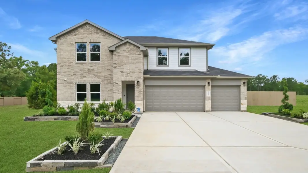 Front exterior of a home in the East Williams Cove community, located in Conroe, TX (Image 2). Front exterior of a home in the East Williams Cove community, located in Conroe, TX (Image 2).