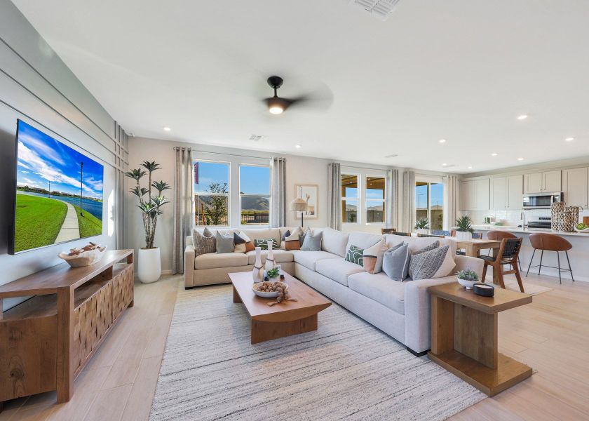 A living room with a large television.