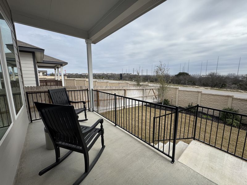 A cozy patio with rocking chairs and scenic views in Hunters Ranch by Chesmar Homes (San Antonio, TX). A cozy patio with rocking chairs and scenic views in Hunters Ranch by Chesmar Homes (San Antonio, TX).