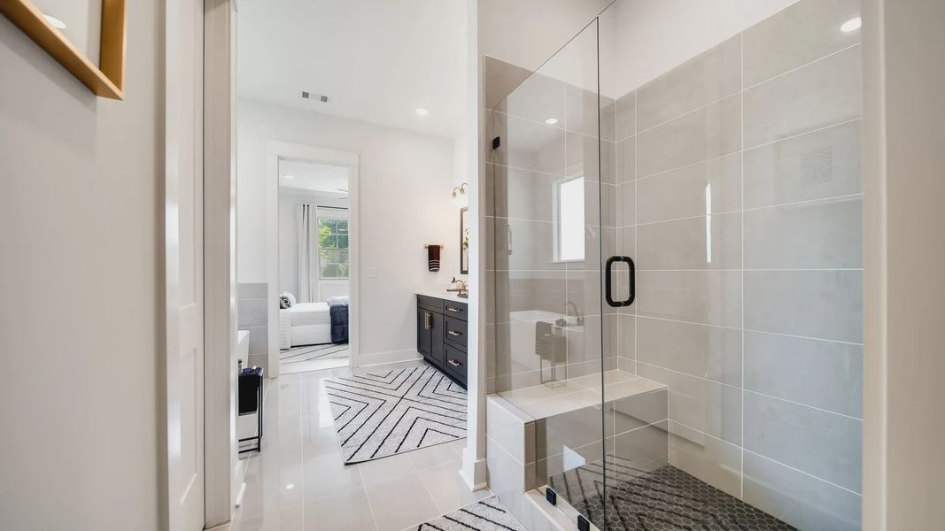 Discover sophistication in Shelton Square with a glass shower, sleek modern vanity, and premium finishes.