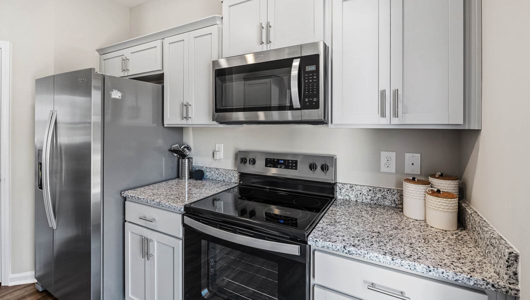 Furnished interior in a model home at Covington Village in Greer (Image 10).