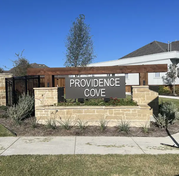 Entrance to the Providence Cove community in McKinney, TX, featuring signage and landscaping (Image 2).