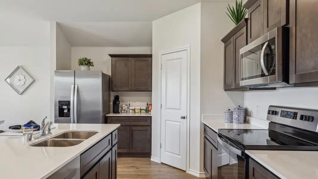 Furnished interior in a model home at Creeks at Burnett Trail in Canton (Image 7).
