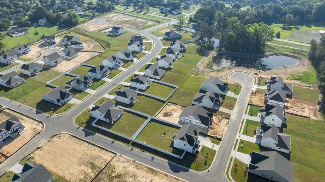 Aerial view of the Eagle Creek community in Fuquay Varina, NC, showing layout and nearby surroundings (Image 13). Aerial view of the Eagle Creek community in Fuquay Varina, NC, showing layout and nearby surroundings (Image 13).
