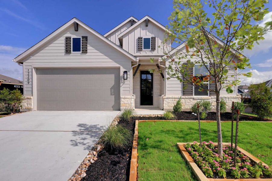 Front exterior of a home in the The Crossvine community, located in Schertz, TX (Image 11).
