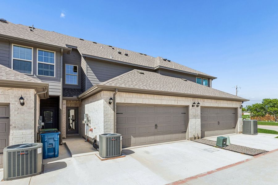 Front exterior of a home in the Sanger Circle – Townhomes community, located in Sanger, TX (Image 35). Front exterior of a home in the Sanger Circle – Townhomes community, located in Sanger, TX (Image 35).