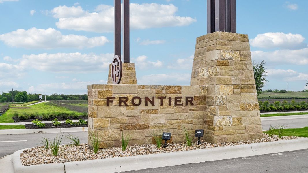 Entrance to the Frontier community in Mustang Ridge, TX, featuring signage and landscaping (Image 4).