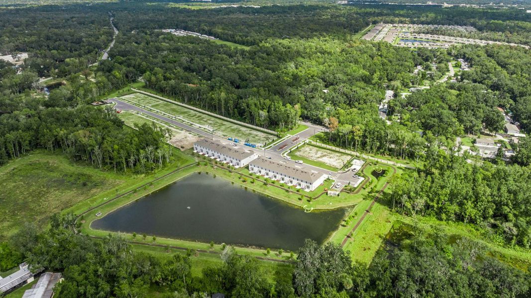 Aerial view of the Sandalwood community in New Smyrna Beach, FL, showing layout and nearby surroundings (Image 1).
