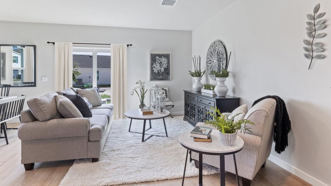 Furnished interior in a model home at Asher Park in Lehigh Acres (Image 8).