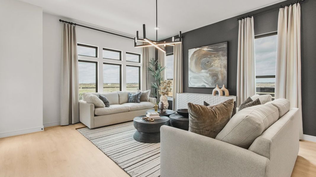 Natural light and modern fixtures create a bright, stylish living room in this Bridgeland Central home.