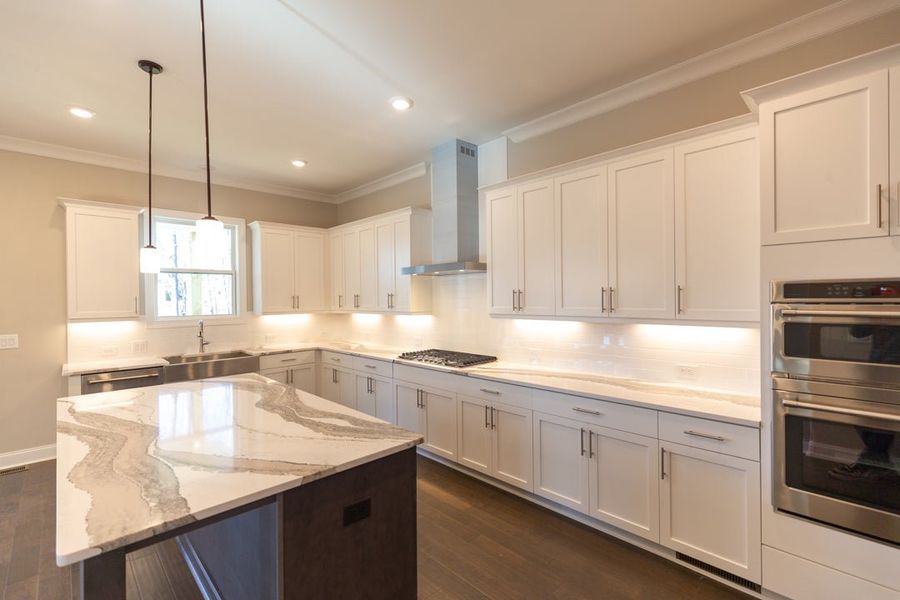 Furnished interior in a model home at Waterhaven in Cumming (Image 40).