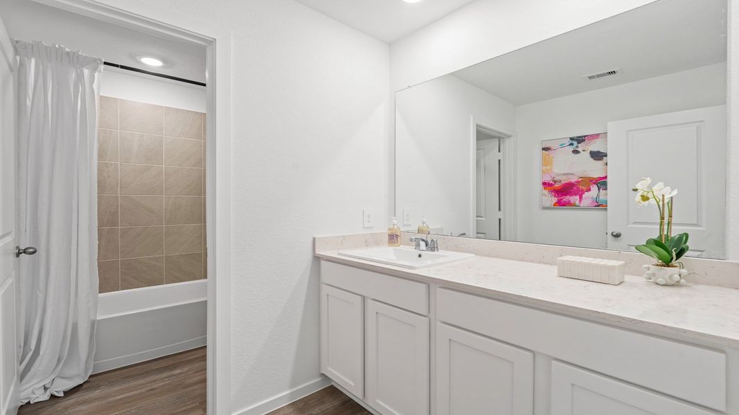 Furnished interior in a model home at Sunterra Lakes in Brookshire (Image 19).