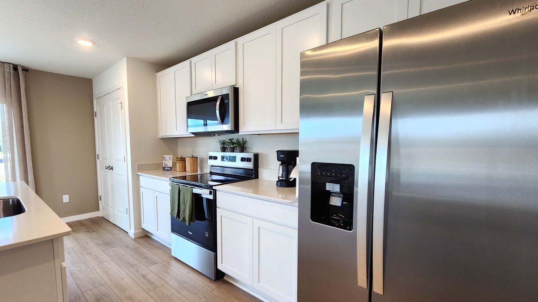 Furnished interior in a model home at Vineland Reserve in Osteen (Image 6).