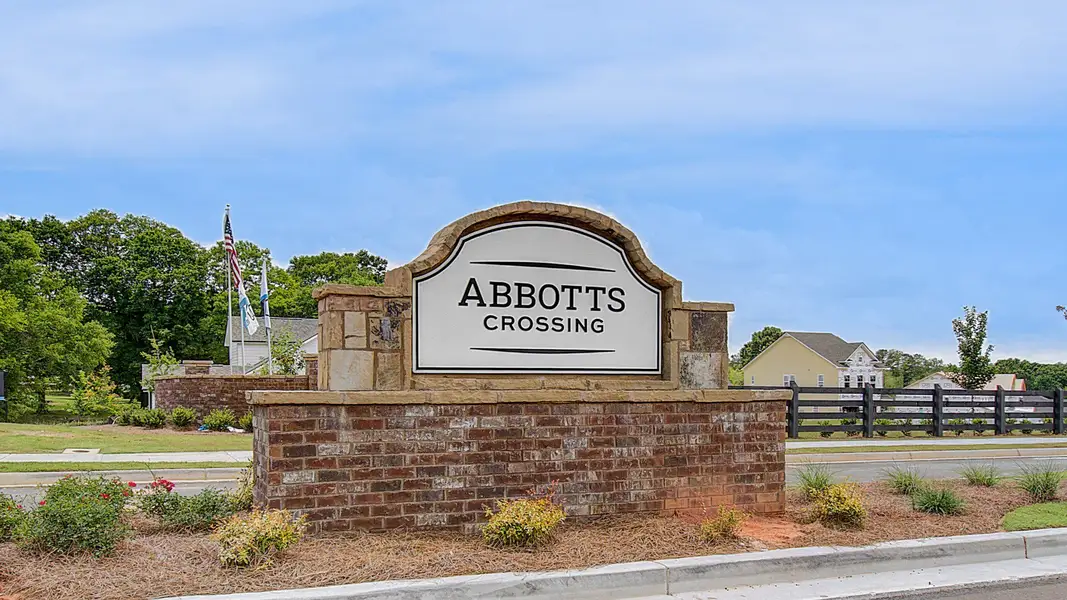 Entrance to the Abbotts Crossing community in Conyers, GA, featuring signage and landscaping (Image 1).