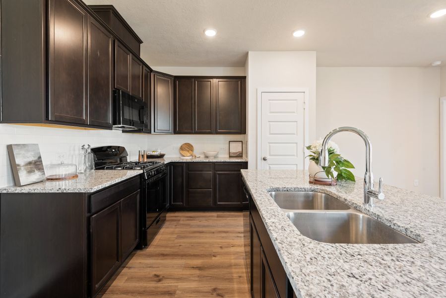 Furnished interior in a model home at Heartland at Vintage Farms in Brenham (Image 7).