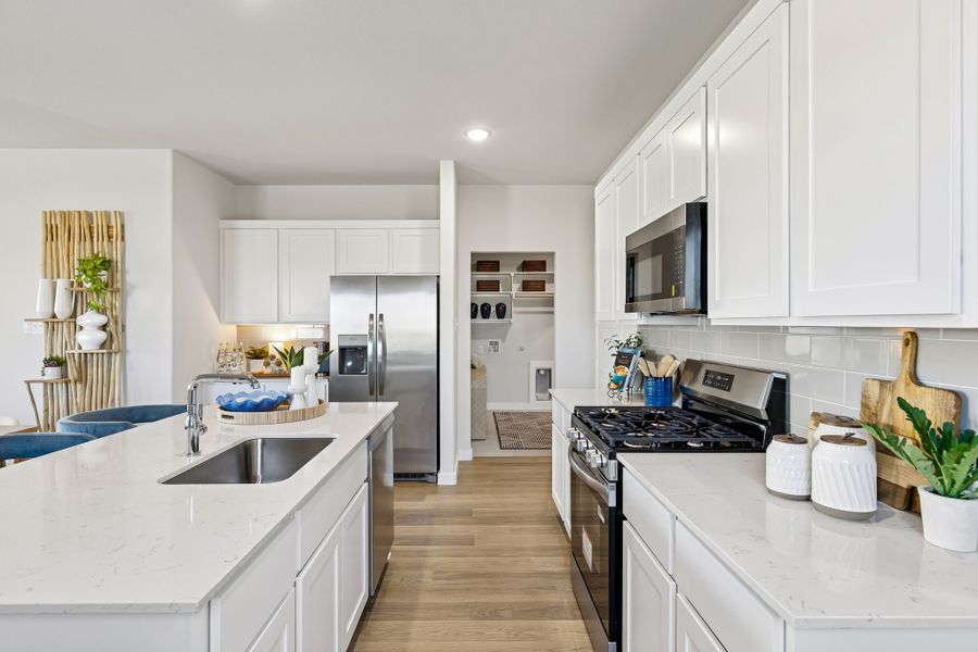 Kitchen in a Nicholson Ranch Magnolia Model Home in Lavon TX by Trophy Signature Homes