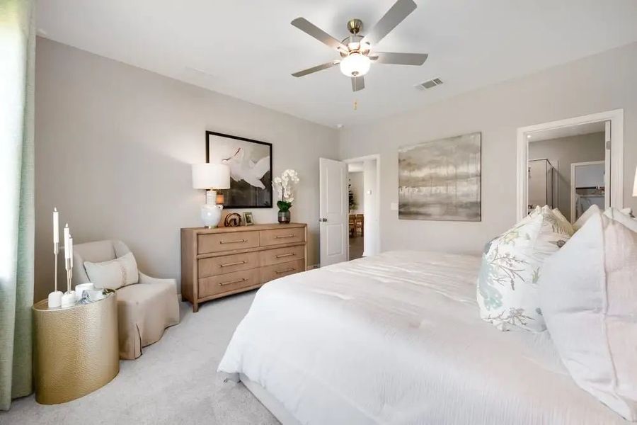 Furnished interior in a model home at Village Grove in Dripping Springs (Image 17).