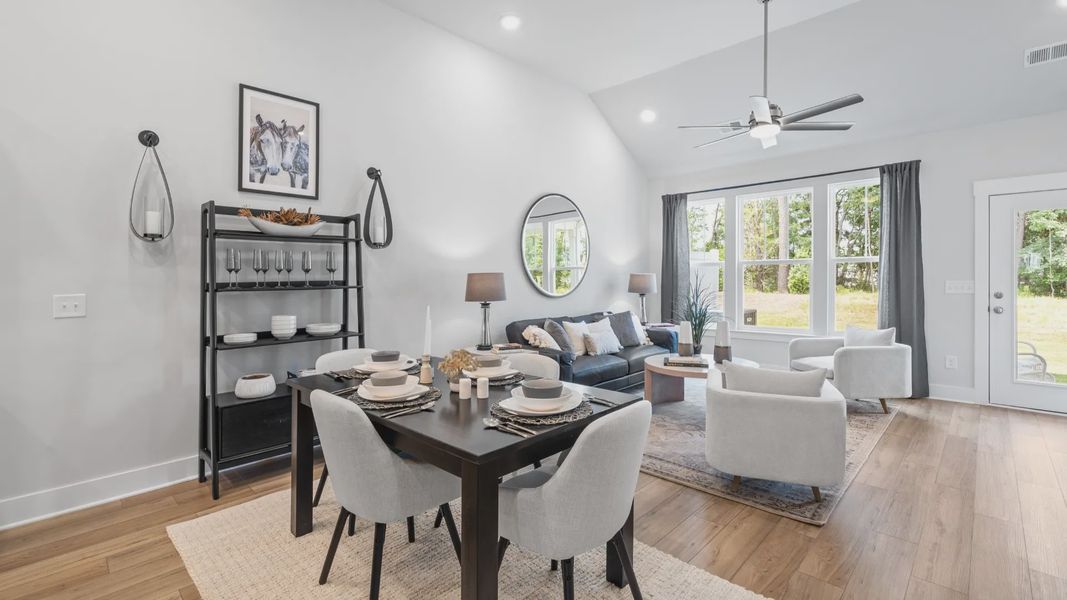 Elevated family room with two story ceilings and ceiling fan with large windows at Aspen Ridge by DRB Homes in Lyman, SC Elevated family room with two story ceilings and ceiling fan with large windows at Aspen Ridge by DRB Homes in Lyman, SC