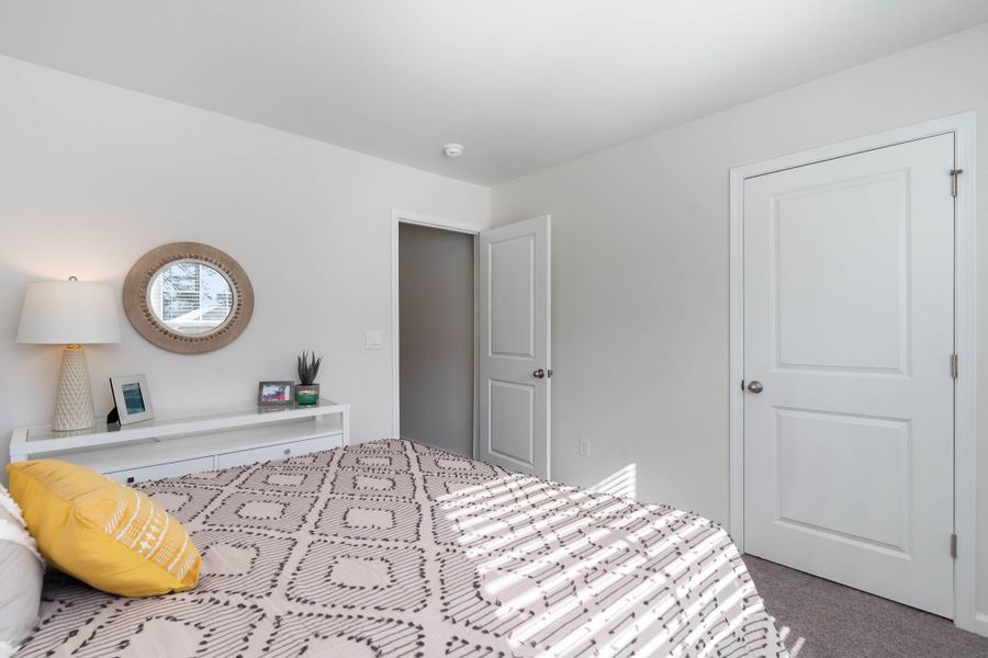 Furnished interior in a model home at Island Green in Myrtle Beach (Image 44).