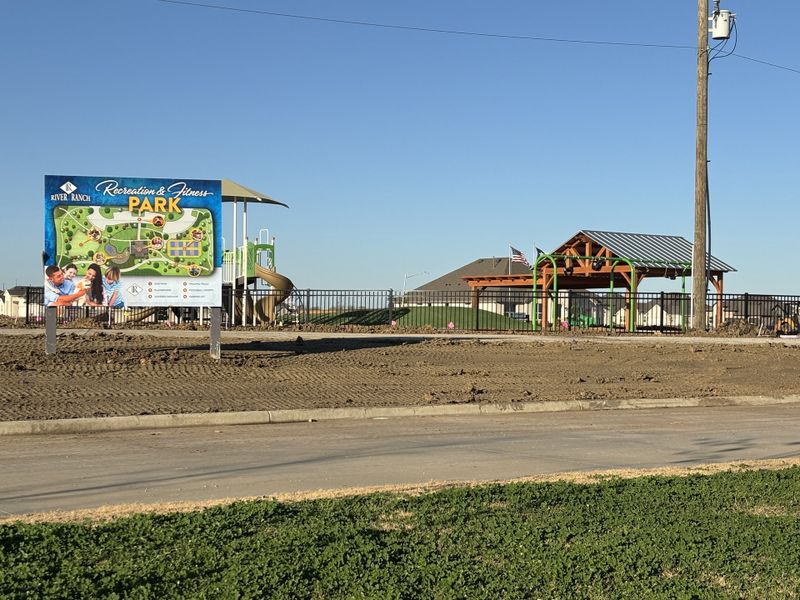 Charming park with playground and gazebo in Mason Ranch II by New Home Co. (Surprise, AZ). Perfect for recreation and fitness.