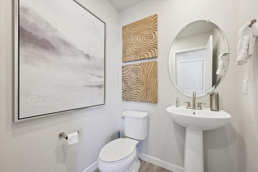 A bathroom with a sink and a toilet.