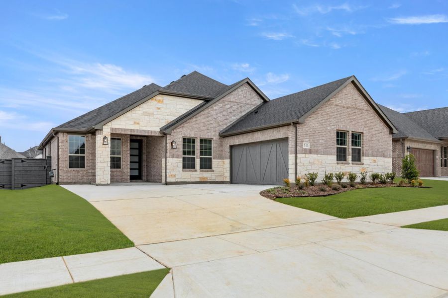 Front exterior of a home in the Union Park 60s community, located in Little Elm, TX (Image 16).