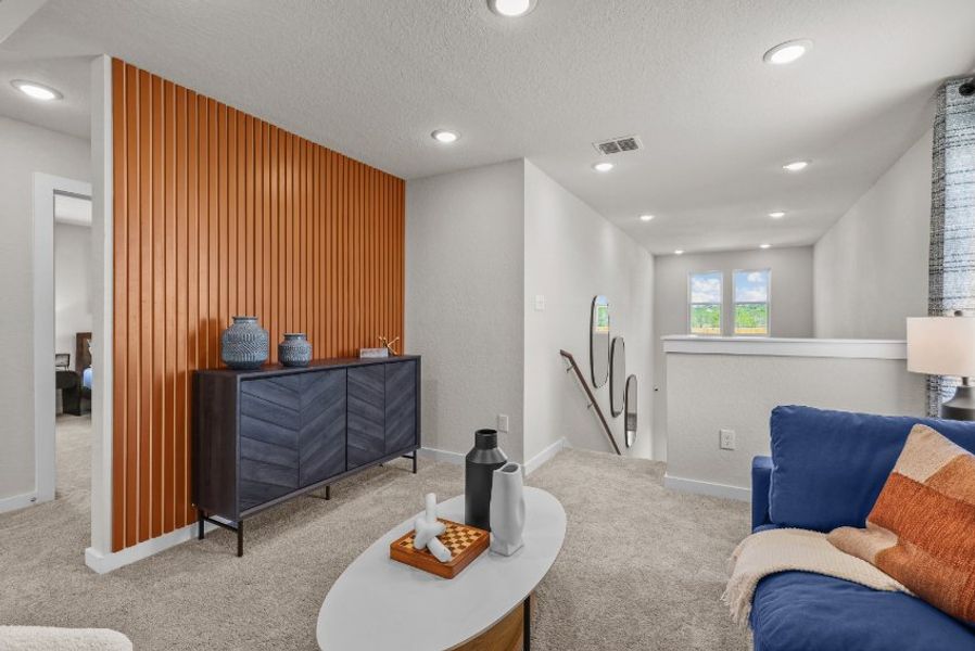 A living room with a couch and a table.