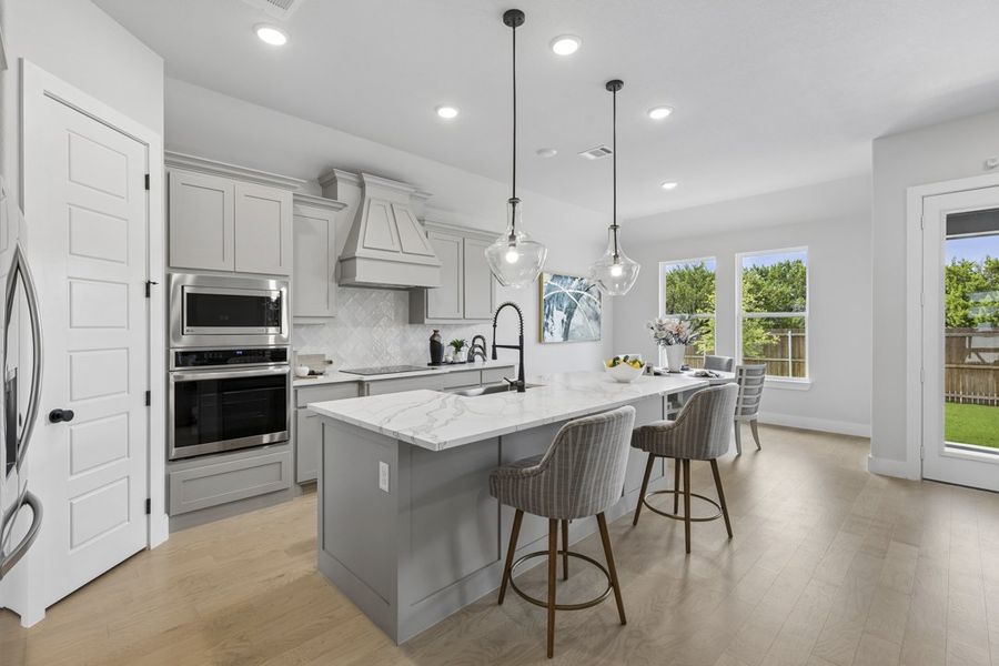 Furnished interior in a model home at Ten Mile Creek in DeSoto (Image 6).