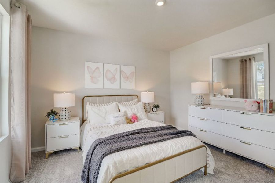 A bedroom with a bed and lamps. A bedroom with a bed and lamps.