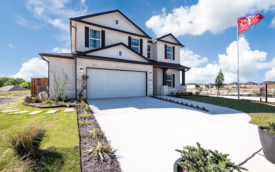 Front exterior of a home in the The Grove community, located in Sherman, TX (Image 2).