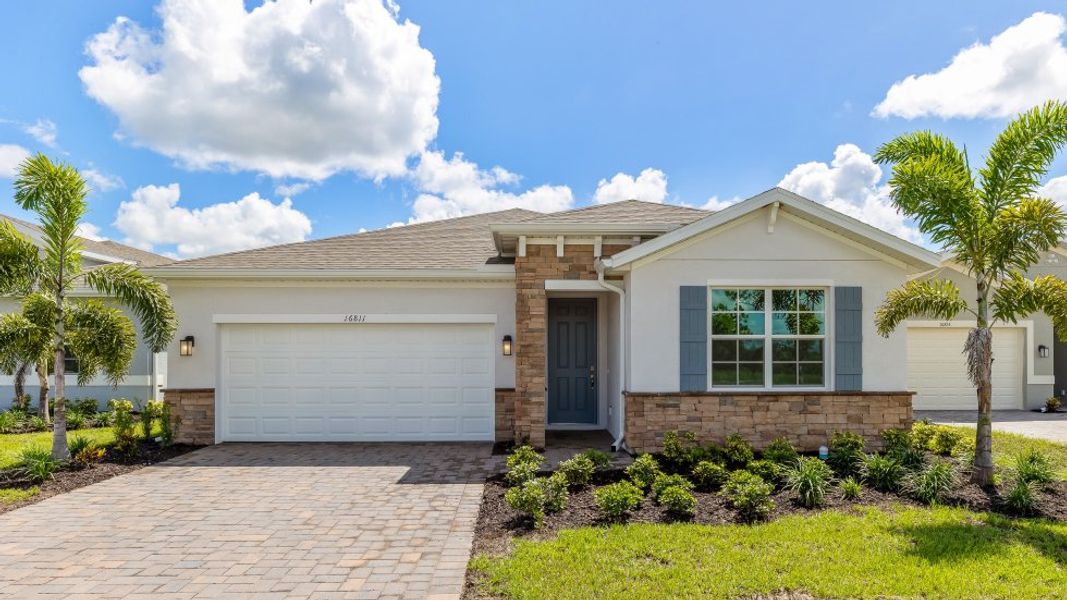 Front exterior of a home in the Coral Lakes - Tradition & Express community, located in Punta Gorda, FL (Image 10).