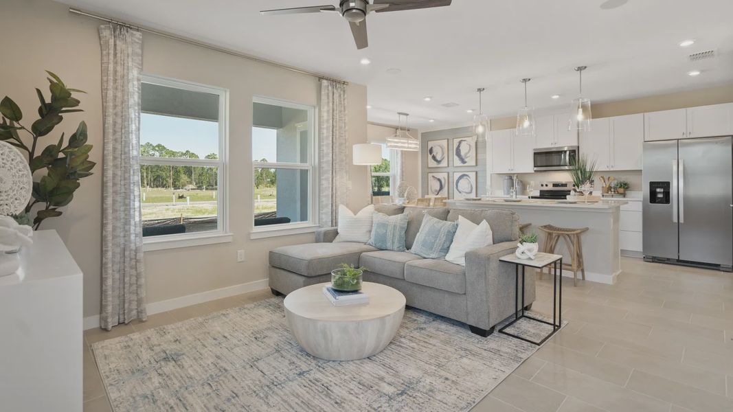 Beautiful living space by DRB Homes, featuring an open staircase and spacious layout for comfort and style Beautiful living space by DRB Homes, featuring an open staircase and spacious layout for comfort and style