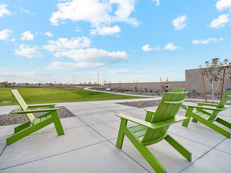 A group of green chairs on a patio. A group of green chairs on a patio.
