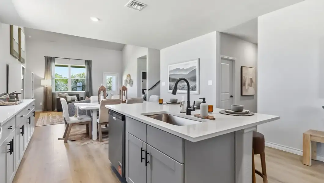 Furnished interior in a model home at The Woodlands at Medina Hills in Mico (Image 29).
