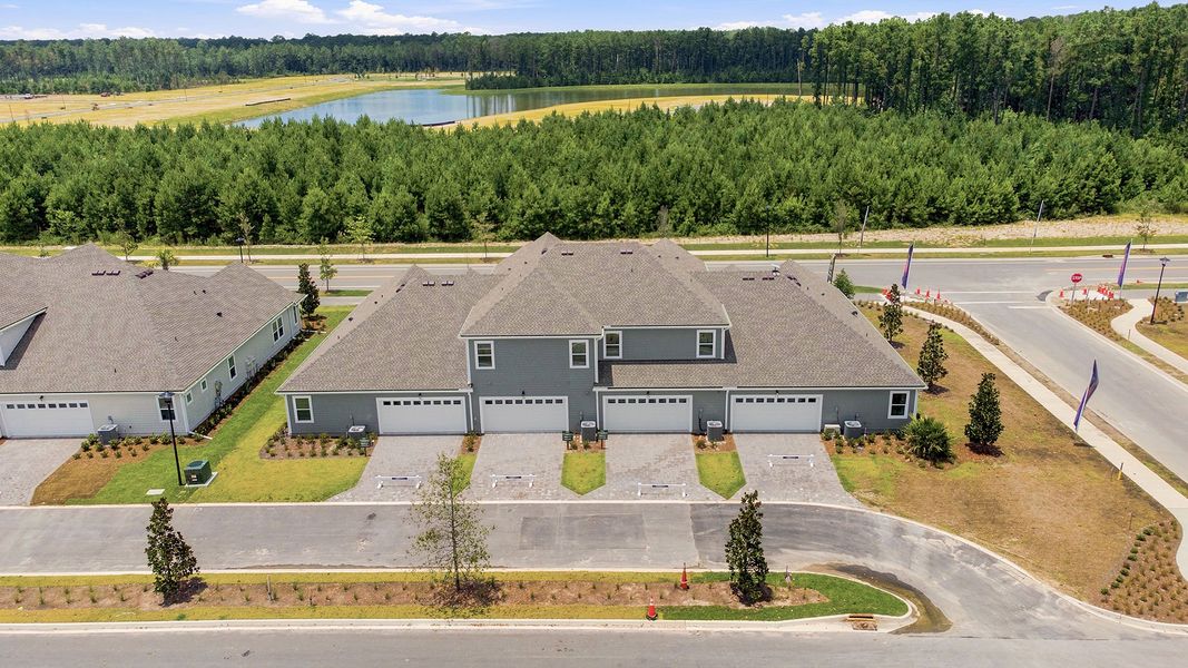 Aerial view of the Westerly Park at Wildlight - Courtyard Collection community in Yulee, FL, showing layout and nearby surroundings (Image 9). Aerial view of the Westerly Park at Wildlight - Courtyard Collection community in Yulee, FL, showing layout and nearby surroundings (Image 9).