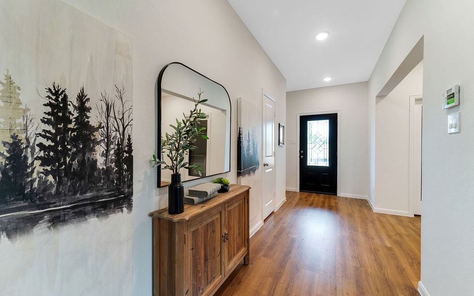 Furnished interior in a model home at The Pines at Seven Coves in Willis (Image 3).