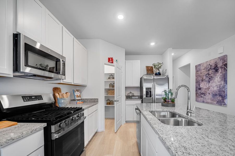 Furnished interior in a model home at Raburn Reserve 50s in Tomball (Image 11).