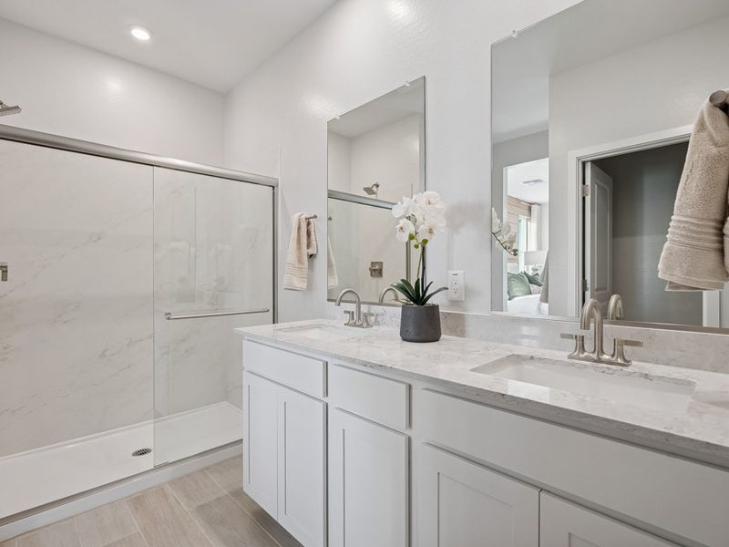 A bathroom with white cabinets. A bathroom with white cabinets.