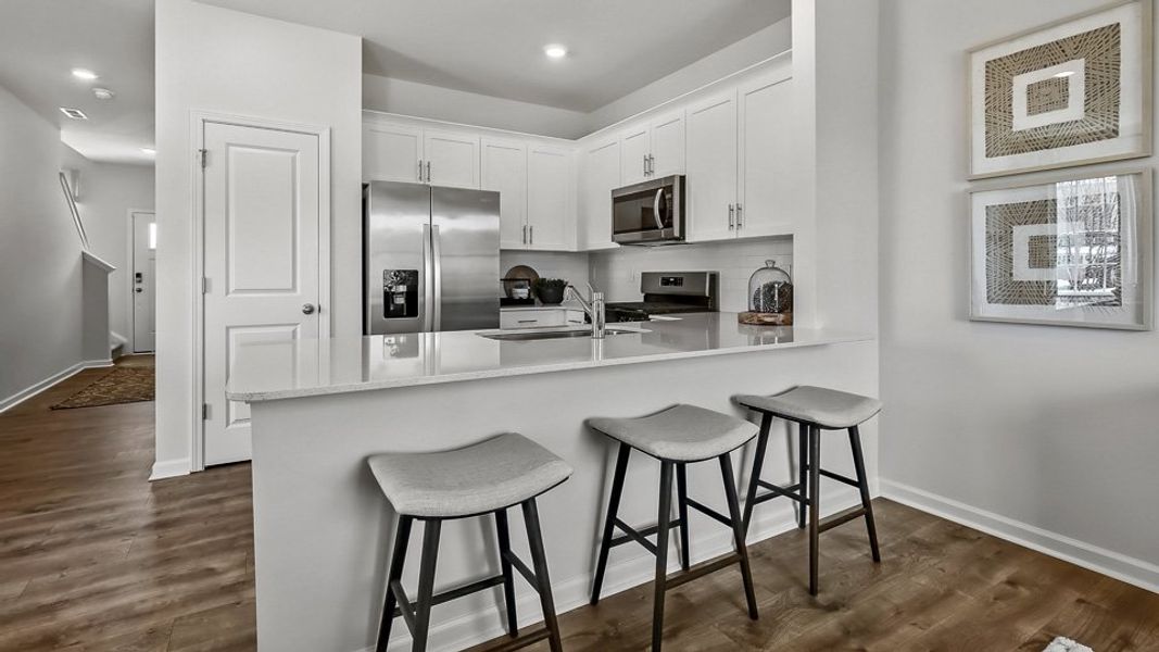 Furnished interior in a model home at The Townes at Prestleigh in Wake Forest (Image 16).