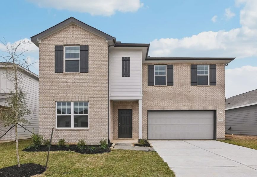 Front exterior of a home in the Sunterra Lakes community, located in Brookshire, TX (Image 12).