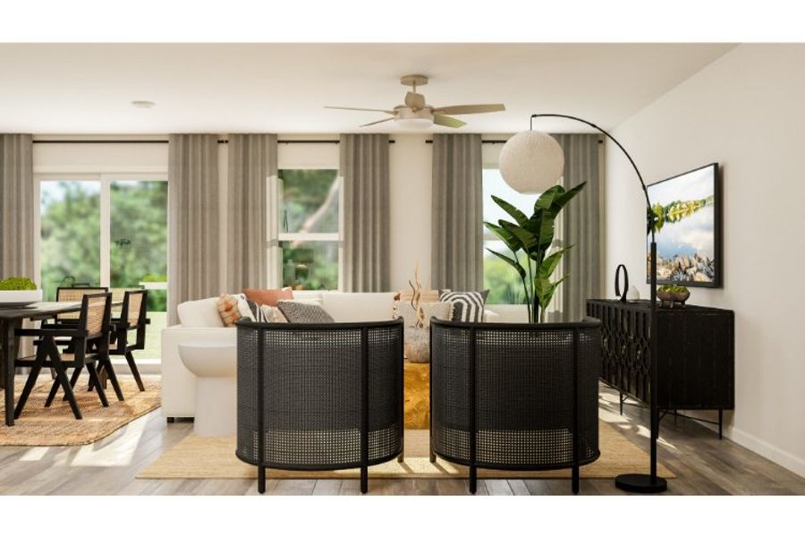 A living room with a couch and chairs.