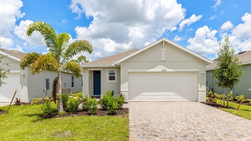 Front exterior of a home in the Bentley Crossing community, located in Fort Myers, FL (Image 13).