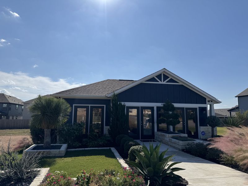 A charming modern home with lush landscaping in Eastwood at Sonterra by Pacesetter Homes (Jarrell, TX).