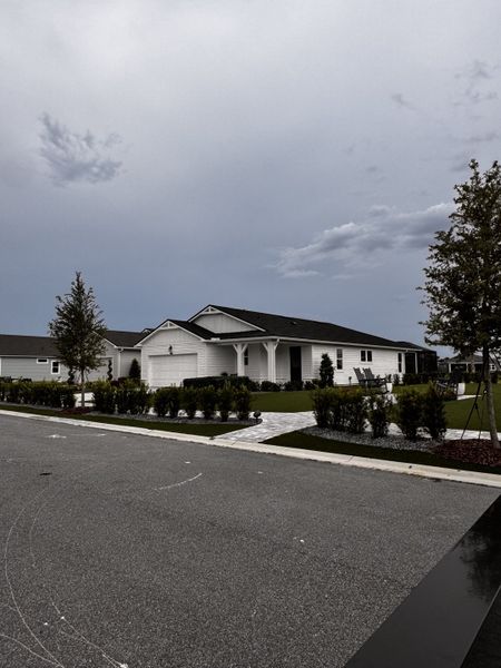 A charming white home with a lush lawn in RiverTown - WaterSong by Mattamy Homes, St. Johns, FL. A charming white home with a lush lawn in RiverTown - WaterSong by Mattamy Homes, St. Johns, FL.