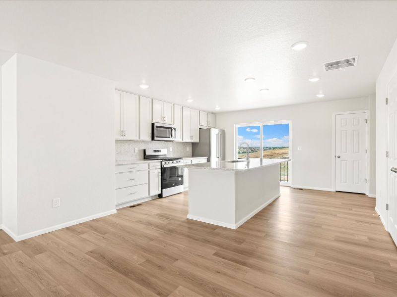 Furnished interior in a model home at Three Hills in Morrison (Image 8).