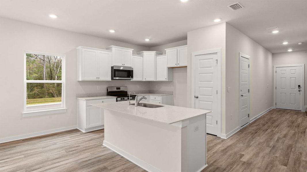 Furnished interior in a model home at Genoa Landing Townhomes in Freeport (Image 7).