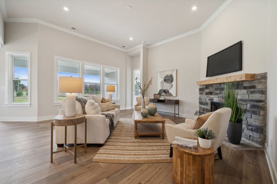 A living room with a fireplace. A living room with a fireplace.